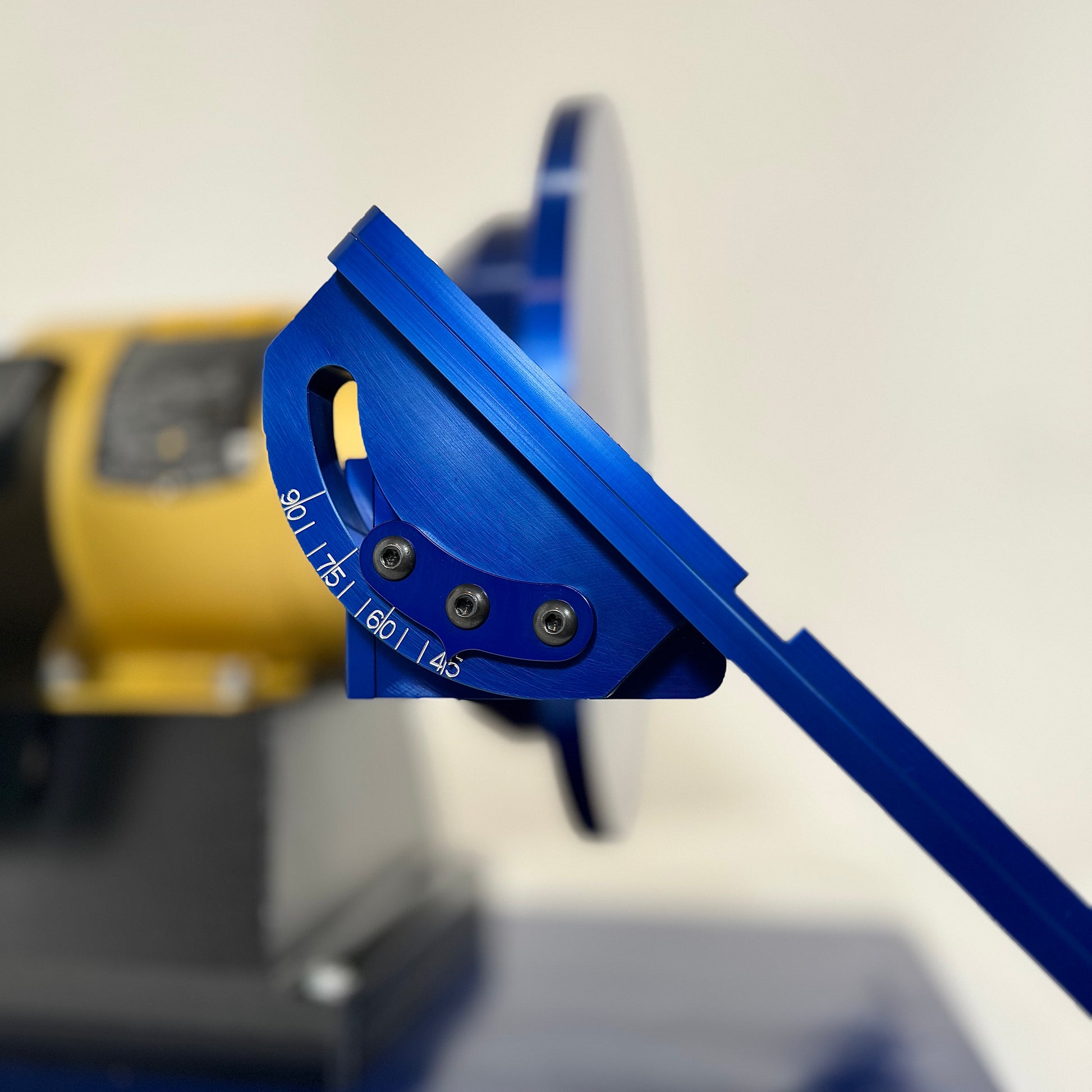 Close-up of adjustable work rest on 12" disc grinder for precise angle grinding