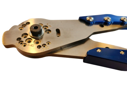 Angled close-up of screw cutter laid flat, highlighting the cutting assembly and D2 steel body with blue grip handle
